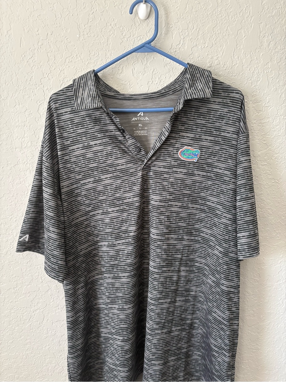 Antigua Men's Black and Gray Heathered Polo with a Florida Gator logo - Picture 1 of 4